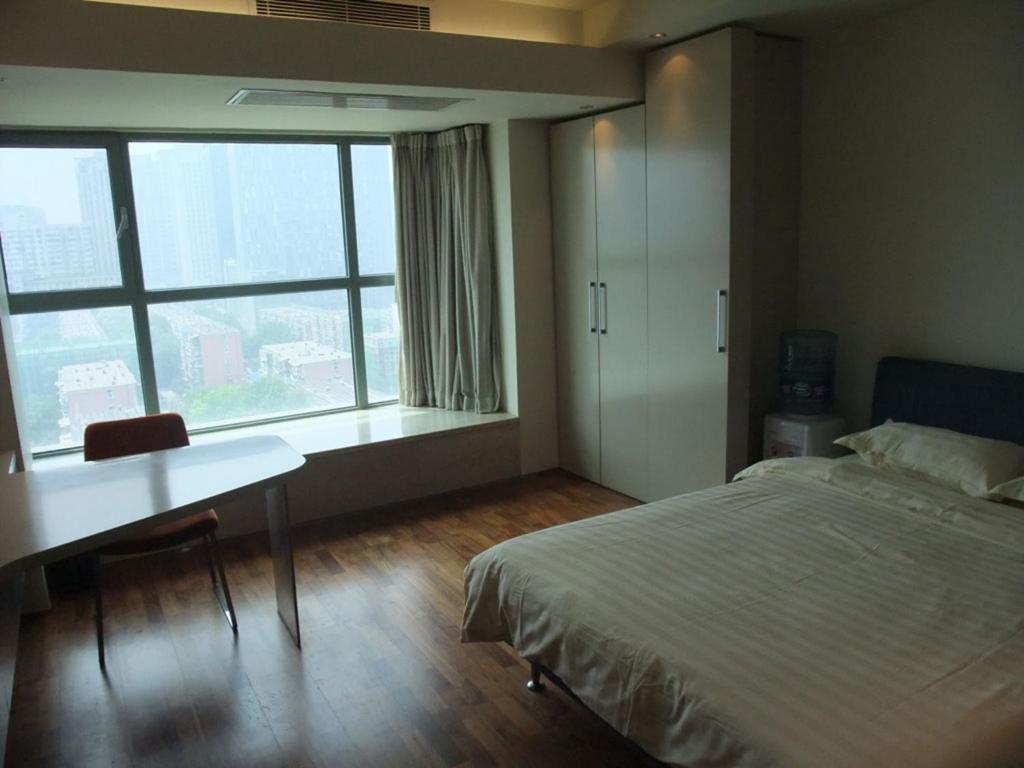 New Oriental Suites Πεκίνο Δωμάτιο φωτογραφία